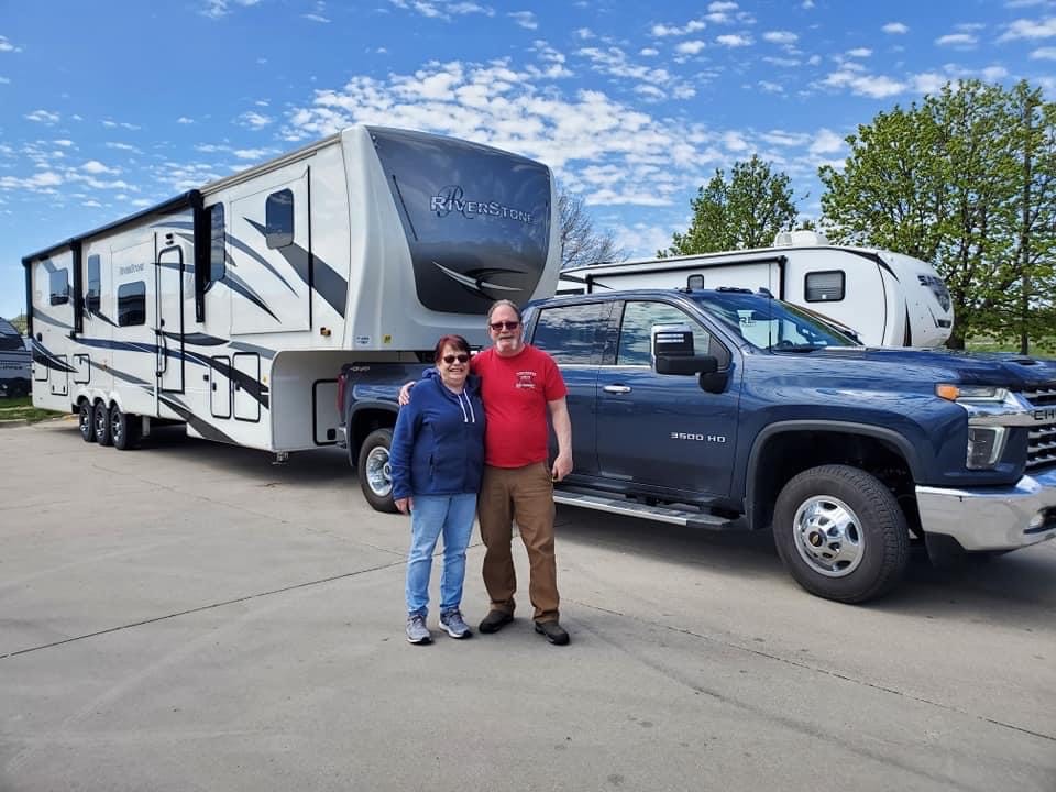 Pic of Dan and Linda picking up Agatha our Forest River Riverstone 42fskg RV. We will tow it home with Brutus our Chevy Silverado 3500 HD dually!